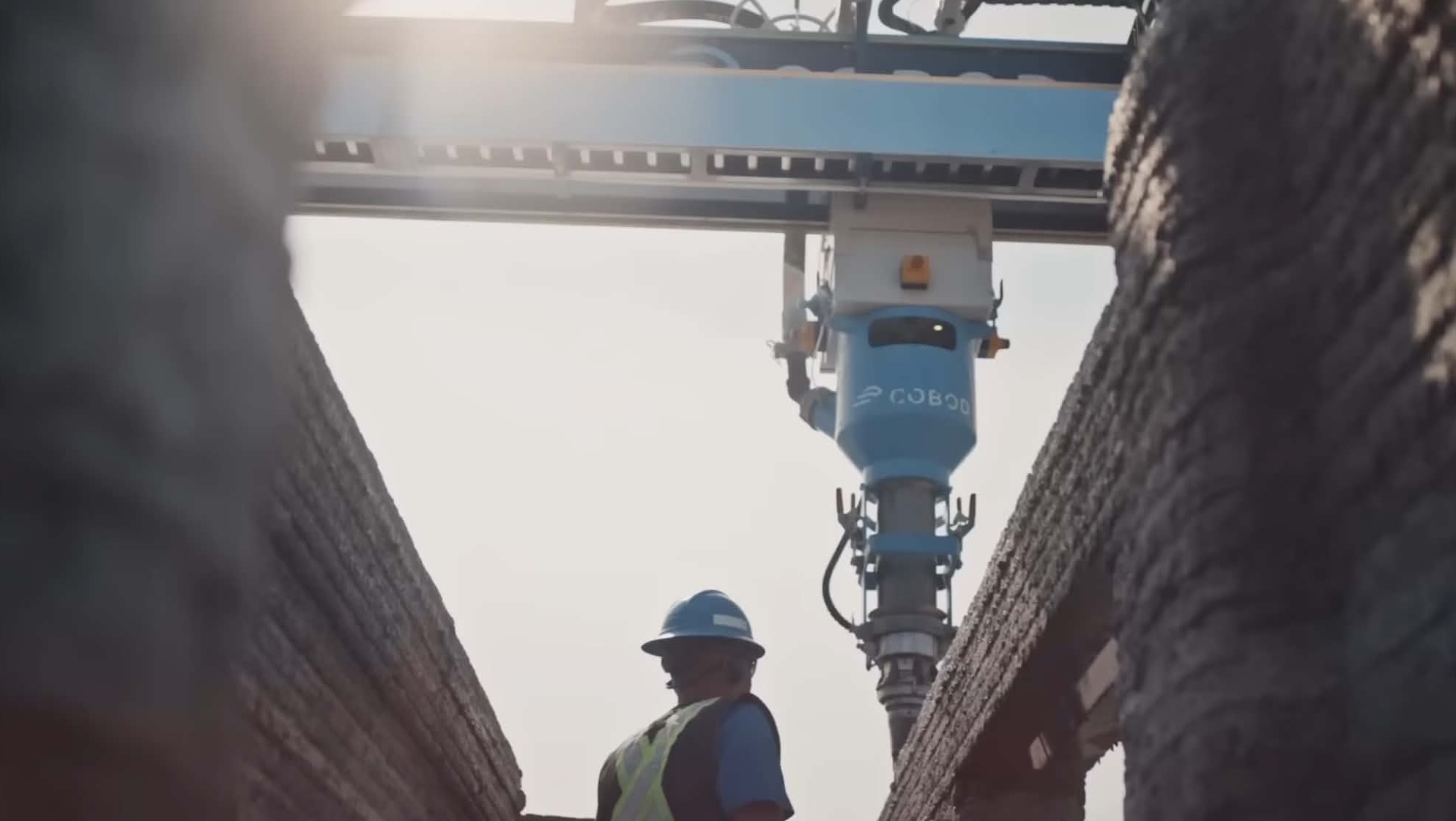 nidus3D COBOD gantry 3D printer extruding concrete on a construction site in Kingston, Ontario